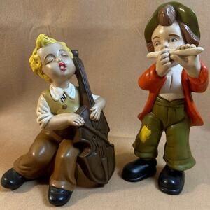 Vintage mid-century ceramic figurines singing boy w/cello & boy w/flute. 1973